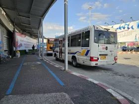 Bus stops in front of the national terminal